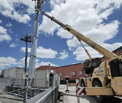 Crane lifting steel jacket into position