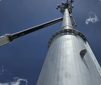 Level one of steel jacket being lifted into position by crane